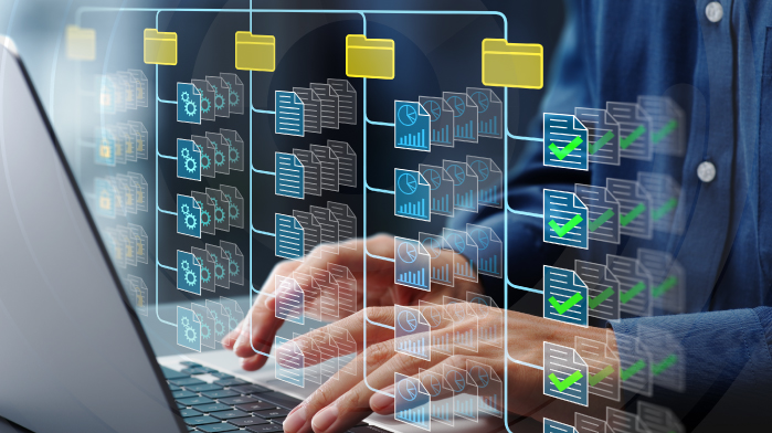 data classification hands on a laptop organizing data into folders